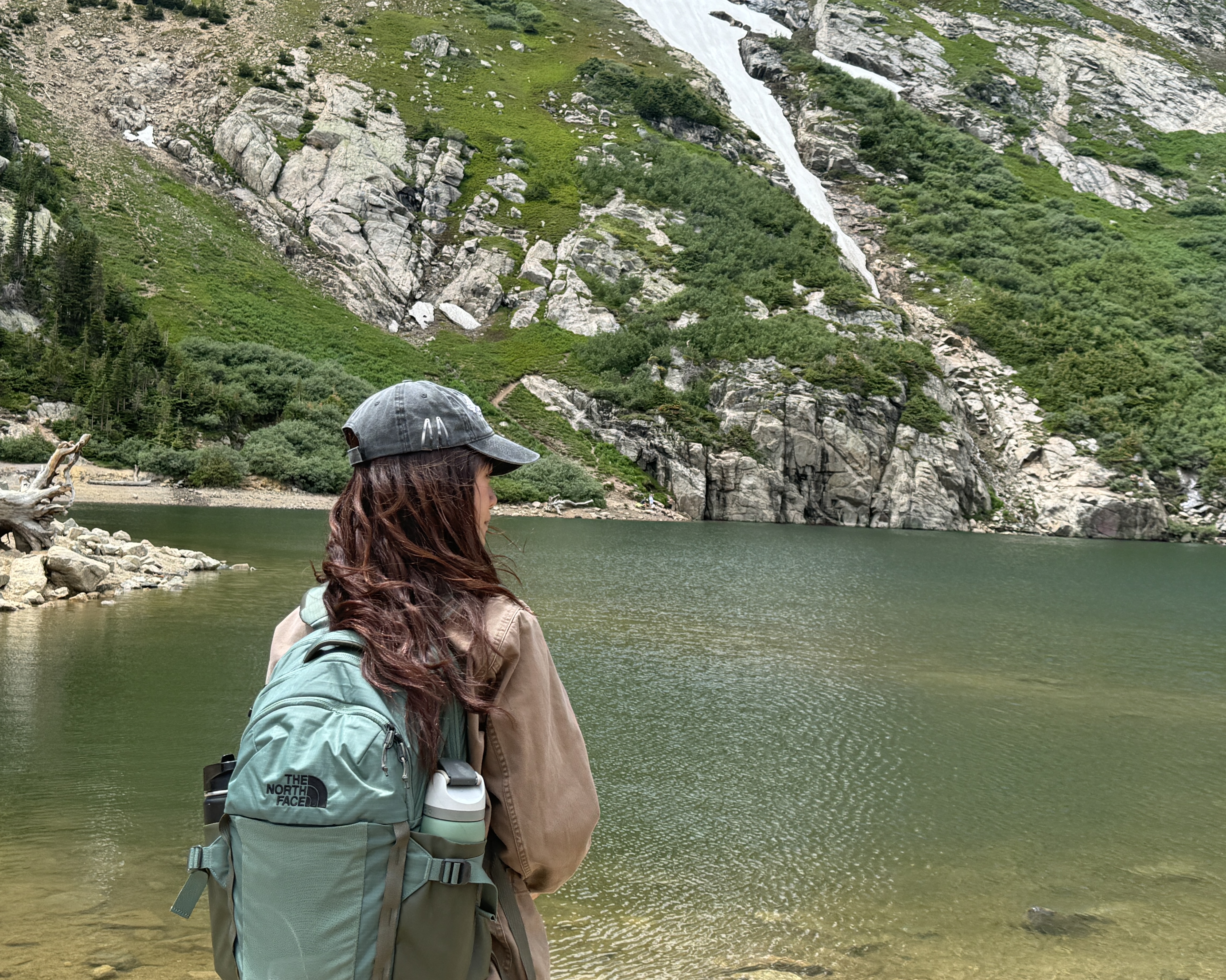 jessica hiking by a mountain lake