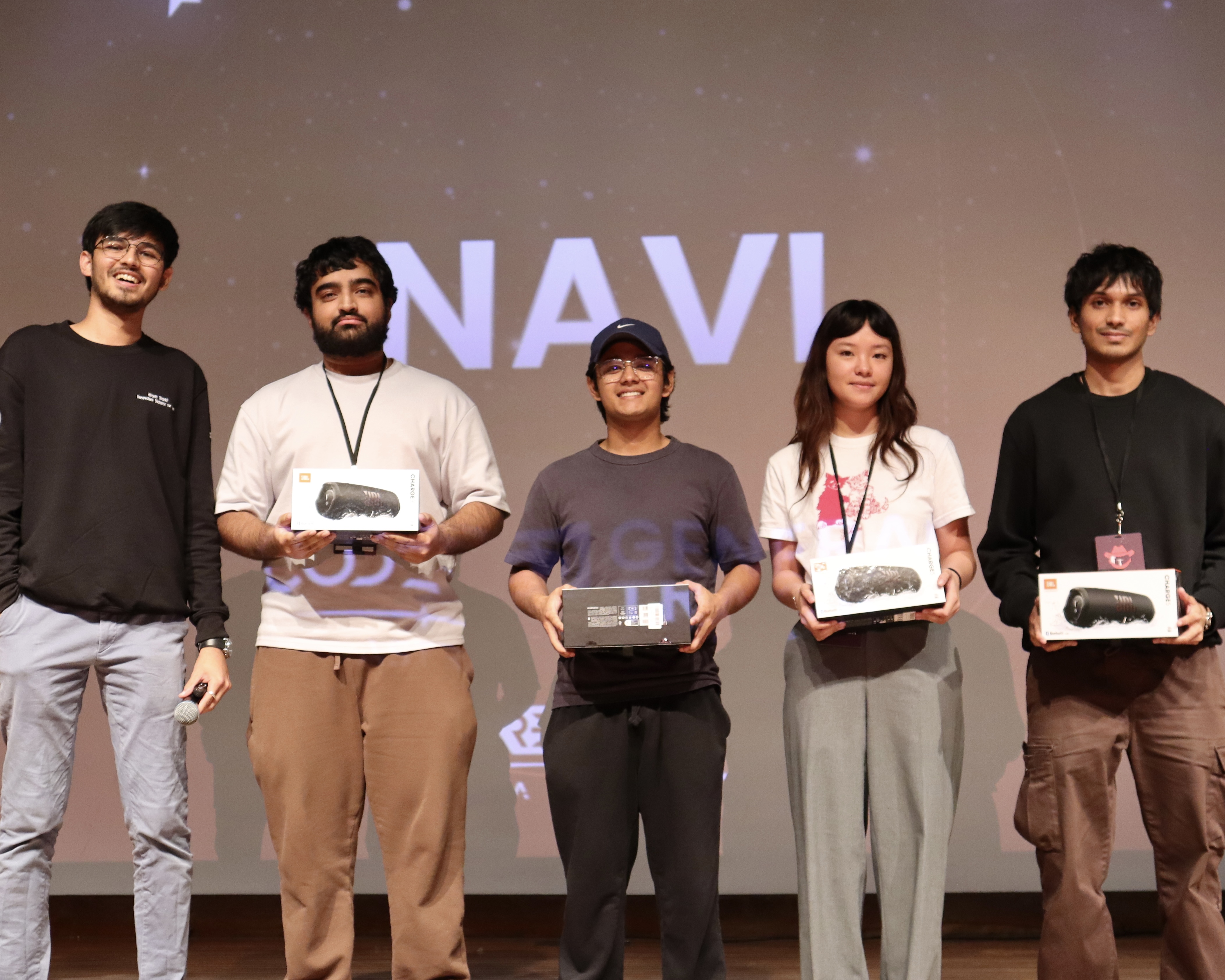 navi team on stage at a tech event